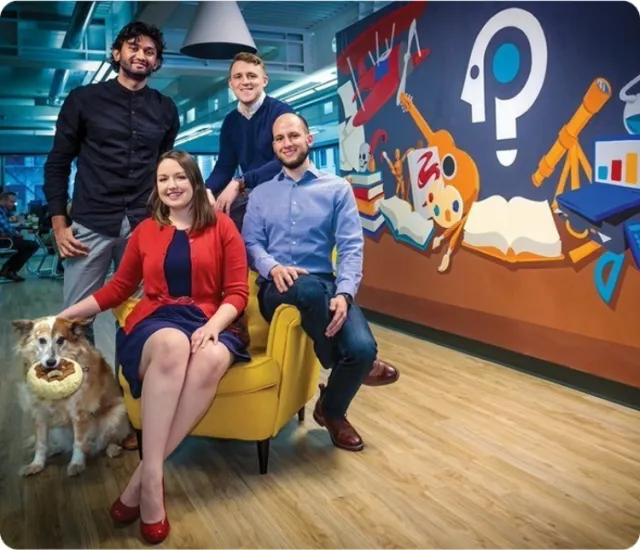 Packback co-founders Nick Currier, Kasey Gandham, Jessica Tenuta, and Mike Shannon pose in the original Packback office in 2013.