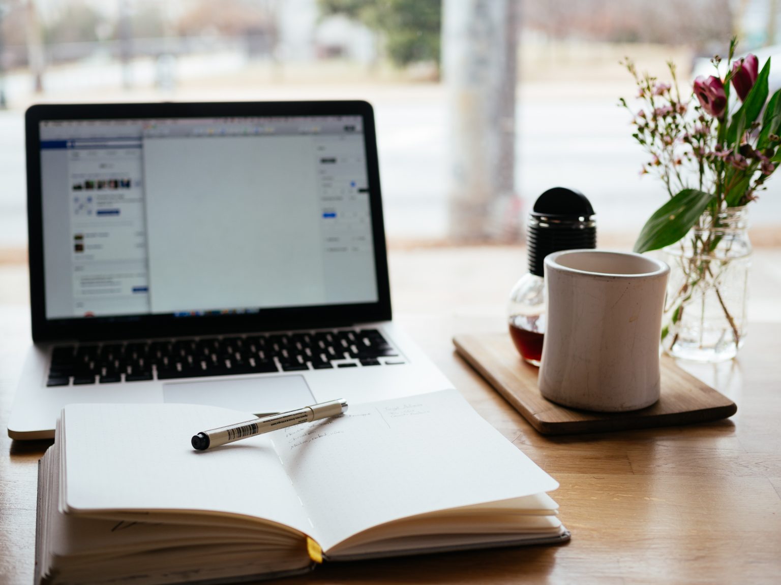 nick-morrison-FHnnjk1Yj7Y-unsplash Laptop with notebook and mug